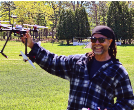 ADS founder holding a drone outdoors